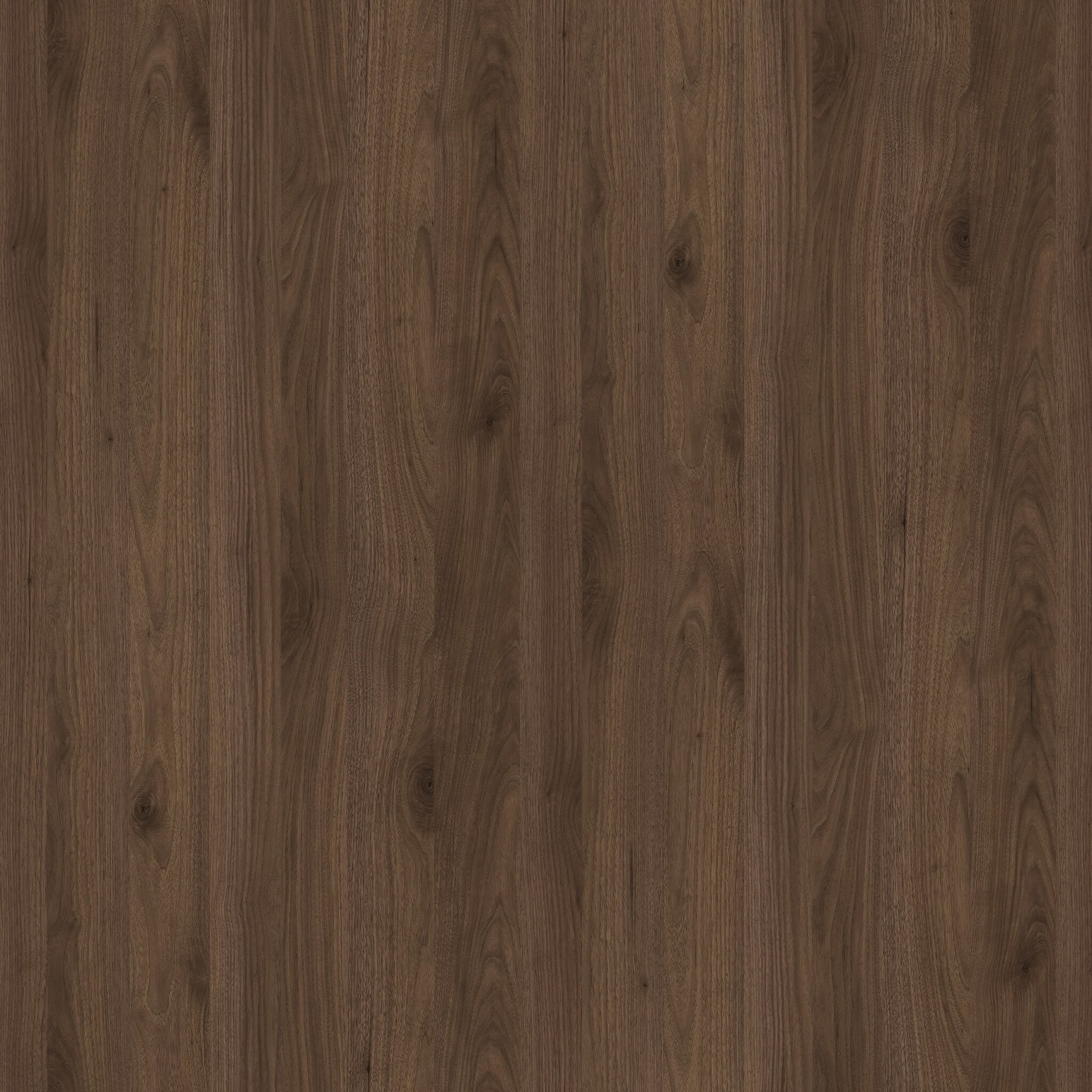 Okapi Walnut / DU R30135 NWOkapi Walnut er en varm valnøttflate med en myk, naturlig årestruktur og en elegant, dyp fargetone. Det klassiske valnøttutseendet skaper en eksklusiv og luksuriøs atmosfære i kjøkkenet. Flaten er perfekt for moderne rom hvor varme og raffinement er ønskelig. En tidløs og stilig trefinish.